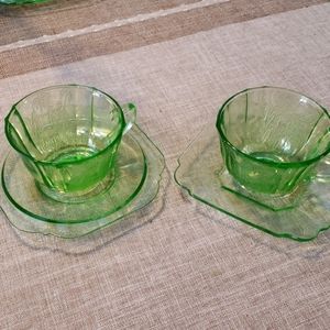 2 Green depression glass cup and saucers